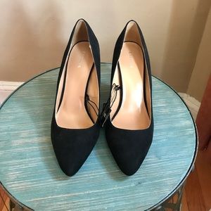 Black faux suede thick heeled pumps.