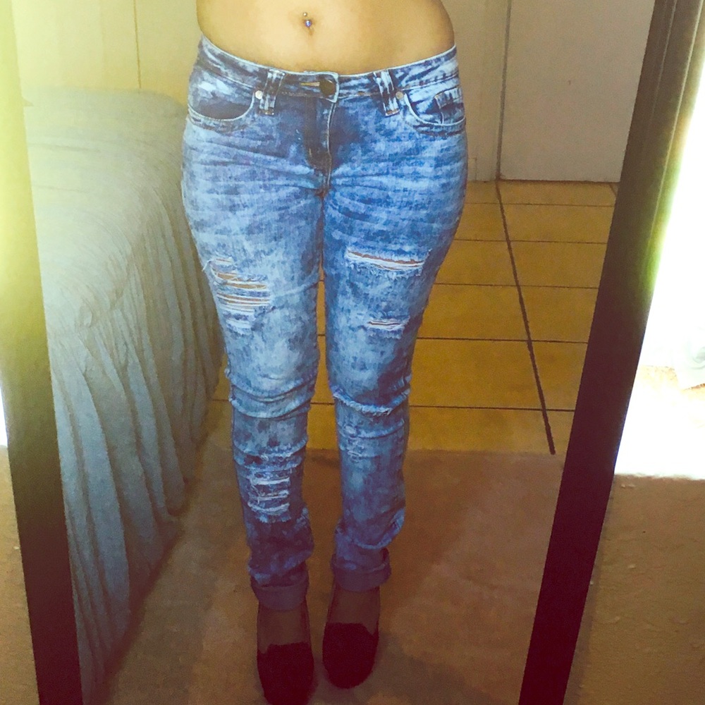 Acid stained ripped jeans