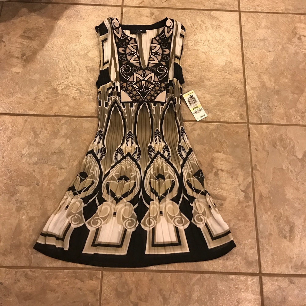 Brand new tan, black, and white patterned blouse