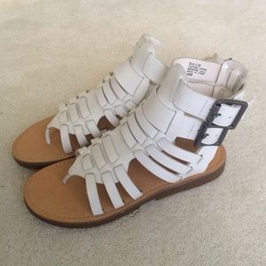 Brand new pair of white sandals