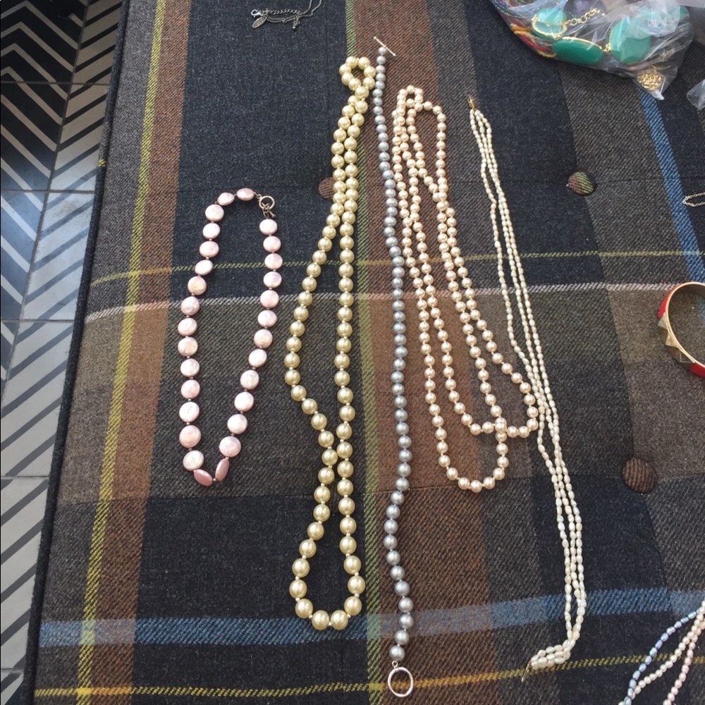 5 pearl necklaces.