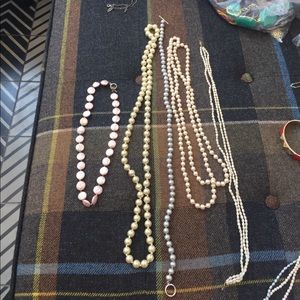5 pearl necklaces.
