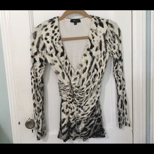 Animal print top with stone design on side.