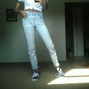 light blue distressed boyfriend jeans .