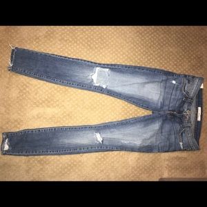 Buckle distressed skinny jeans