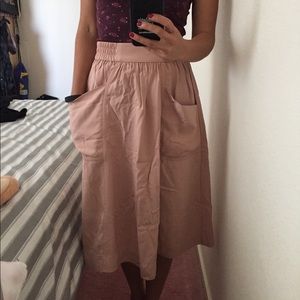 Nude pink midi skirt with front pockets