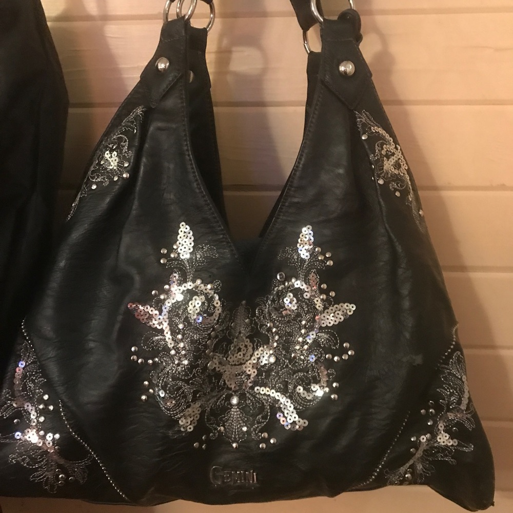 Beautiful Gemini Rising handbag with dust bag