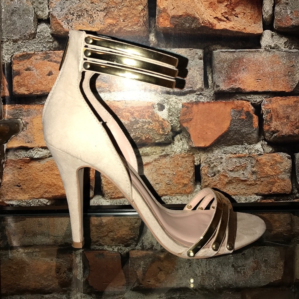 Beige suede pumps with gold embellishments