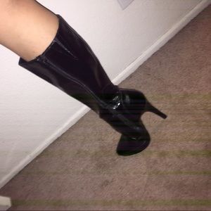 Below the knee black leather boots