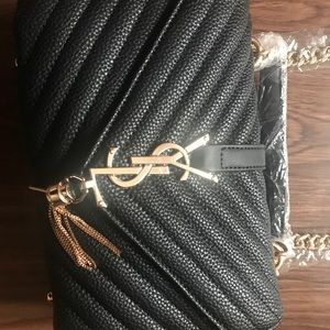 YSL clutch with tassels