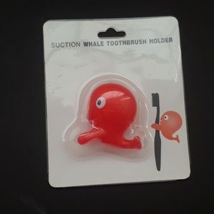 Brand new orange whale toothbrush holder