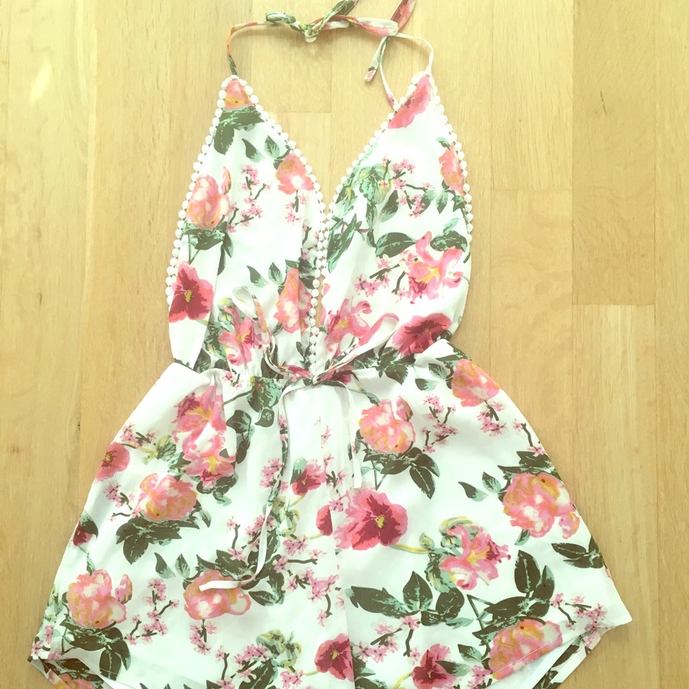 White romper with pink and green floral print