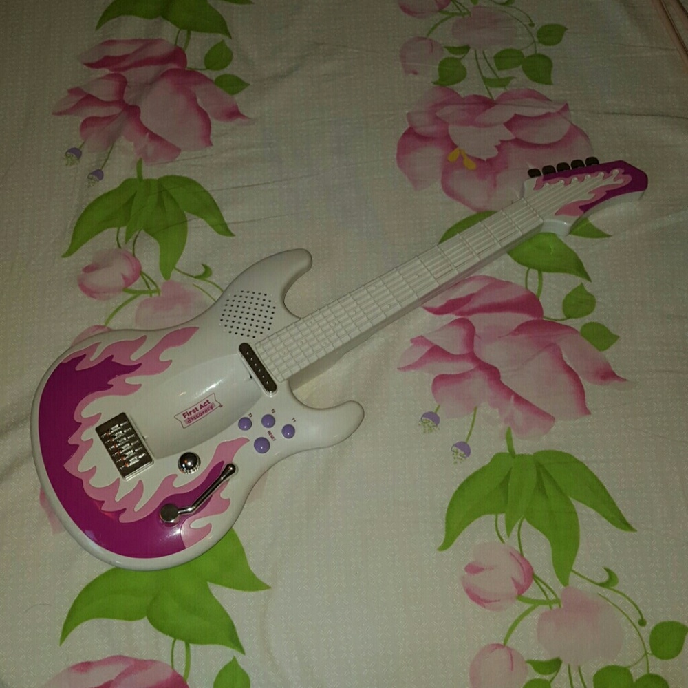 Kids toy electrical guitar plays music