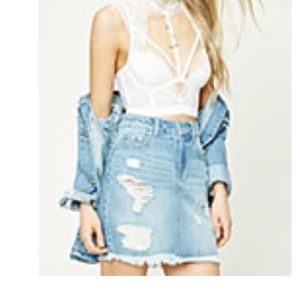 Distressed denim mini skirt