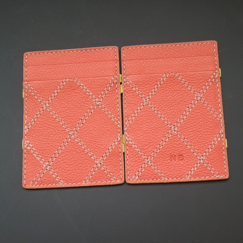 New flip fold orange wallet with initials N.B.