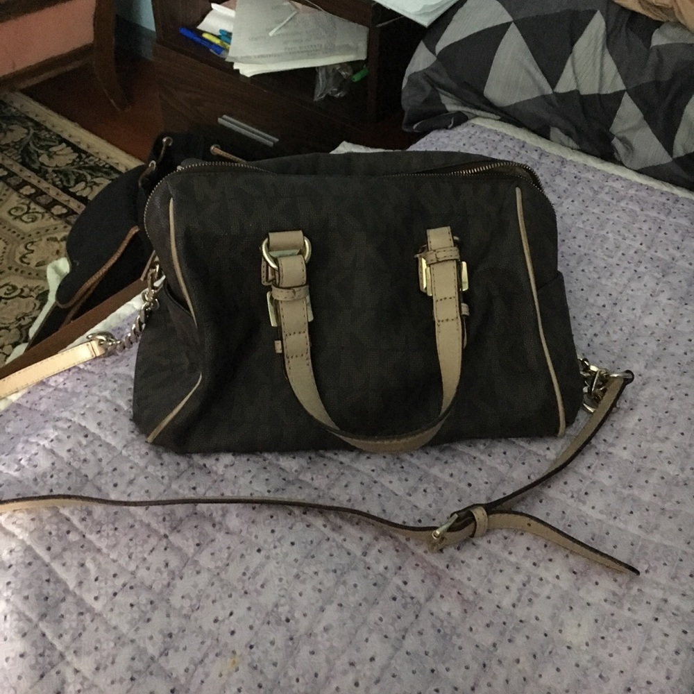 A brown and tan Michael Kors satchel