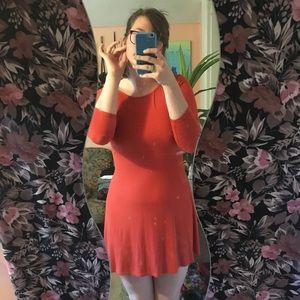Really adorable orange, low cut back dress 🍑
