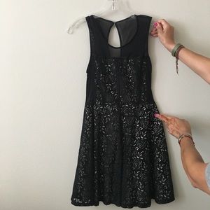 Black lace A line dress. Short midi length