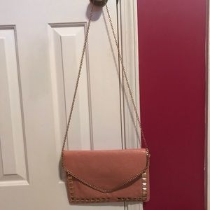 Pink crossbody purse with gold studs