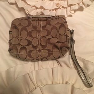 Gold coach wristlet
