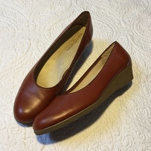 Soft spots brown leather wedges
