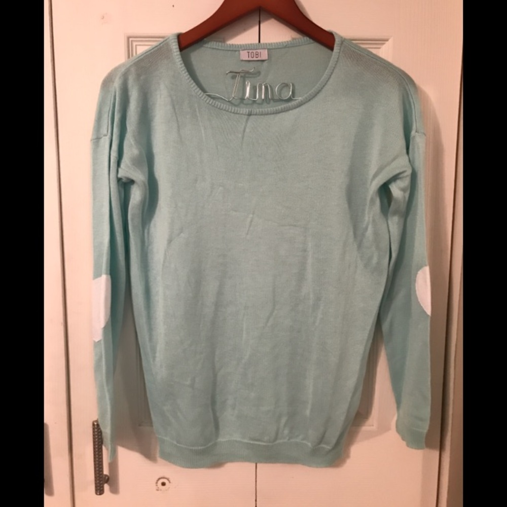 Mint sweater with heart-shaped elbow patches