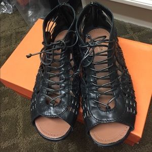 Black flat sandal with zipper back