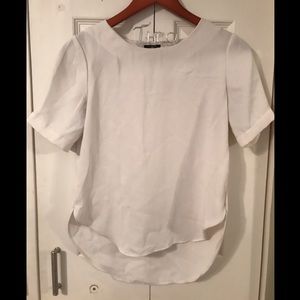 Ivory high-low short sleeve blouse