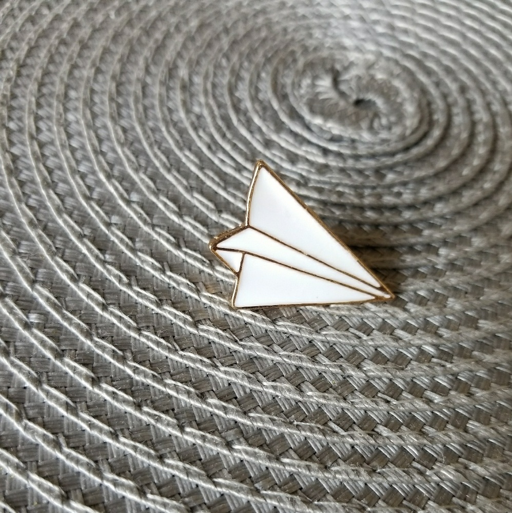 Paper airplane pin