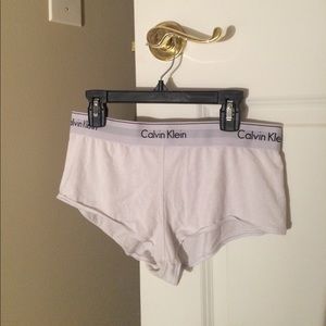 Two pairs of white CK boyshorts