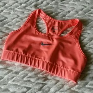 Orange Nike compression sports bra