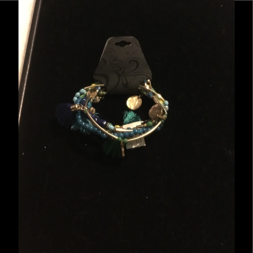 GERU MULTIPLE TURQUOISE BRACELETS W/TASSELS