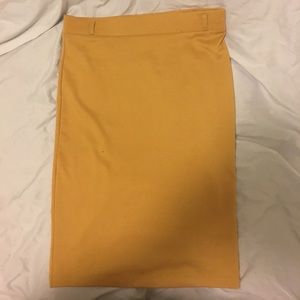 Knee length mustard yellow pencil skirt