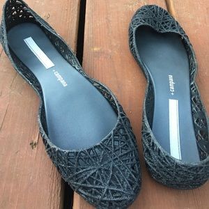 Lightly worn jelly flats