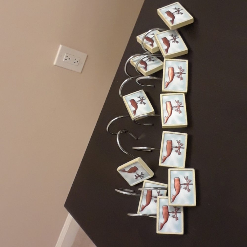 Set of 12 whale curtain hooks