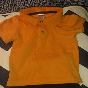 Baby boy outfit includes polo shirt and shorts