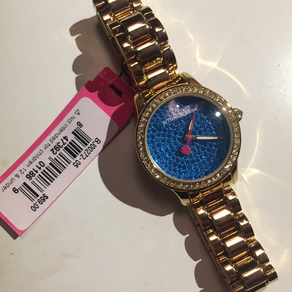 Gold tone bracelet watch with blue crystals 💙