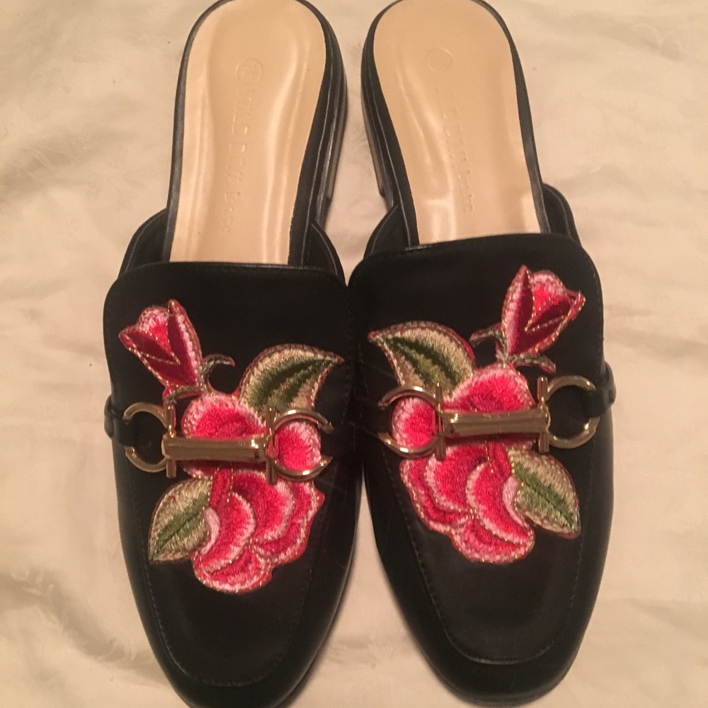 Never been worn size 7.5 slip on loafers w/ roses