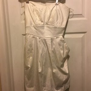 White dress with pockets.