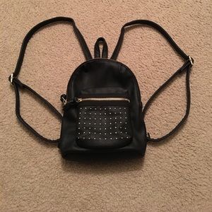 Mini backpack in black with gold stud detailing