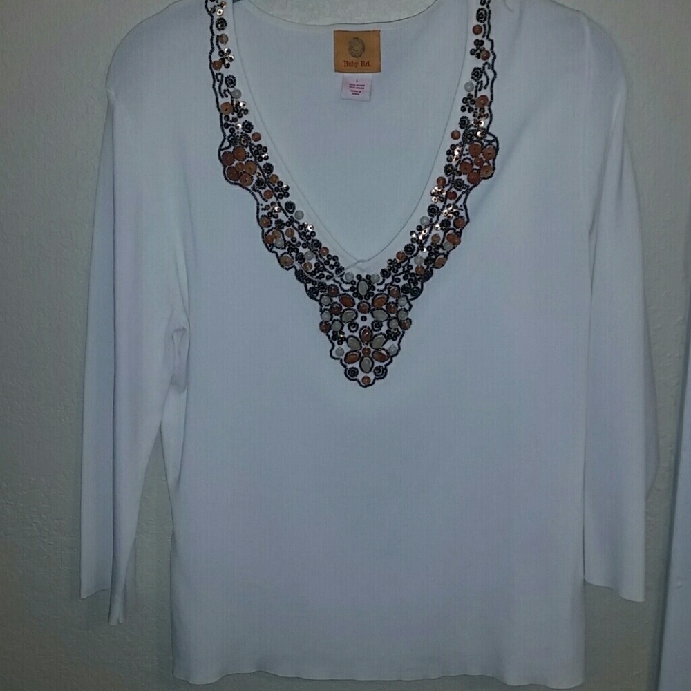 White shirt with jewl style  neck