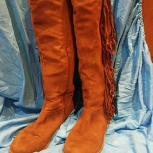Knee high fringe boots