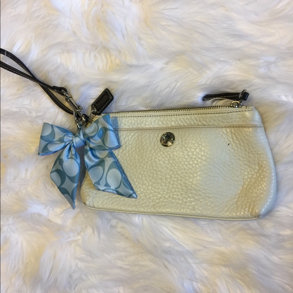 White coach wristlet with blue logo bow
