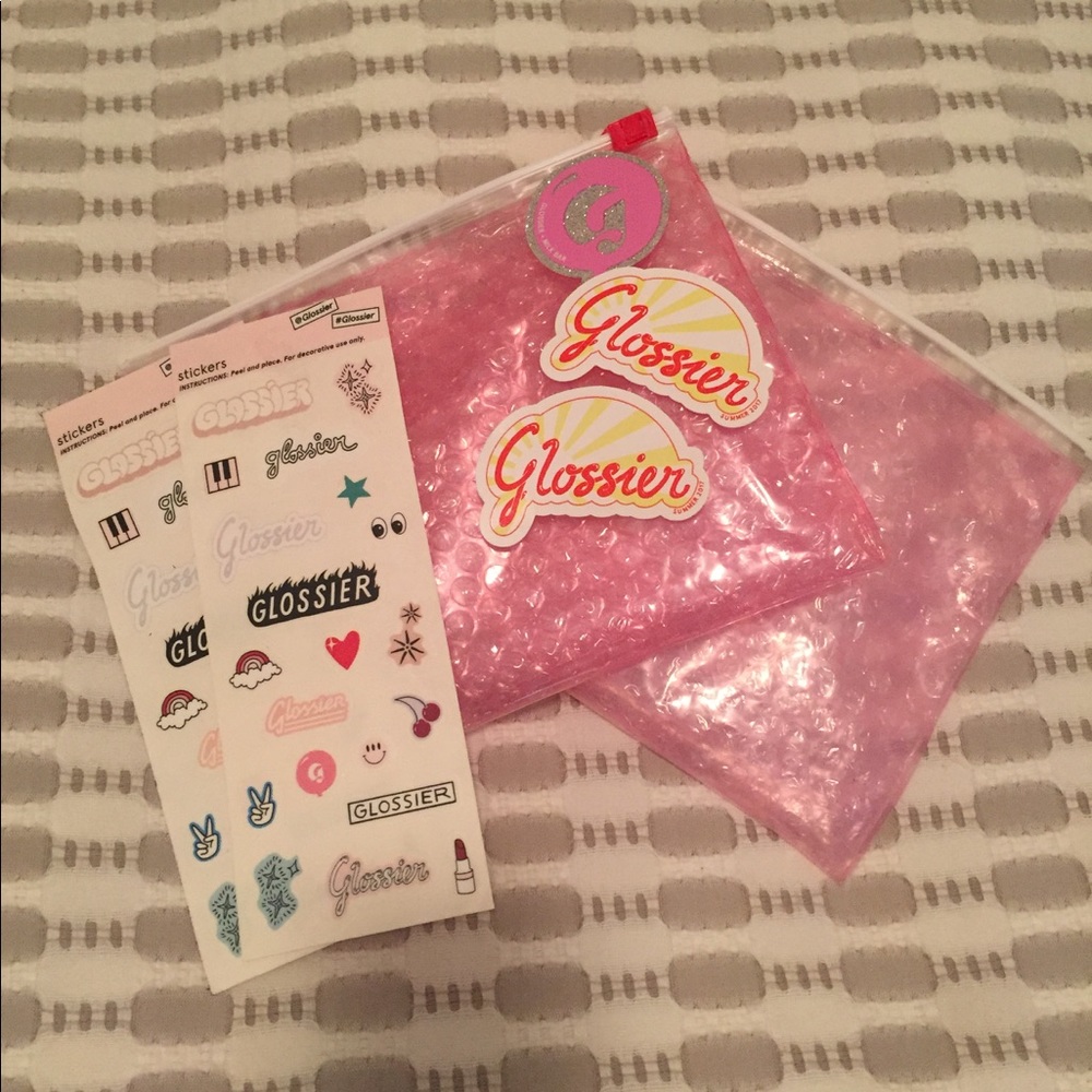 Glossier pink pouch and collectible stickers
