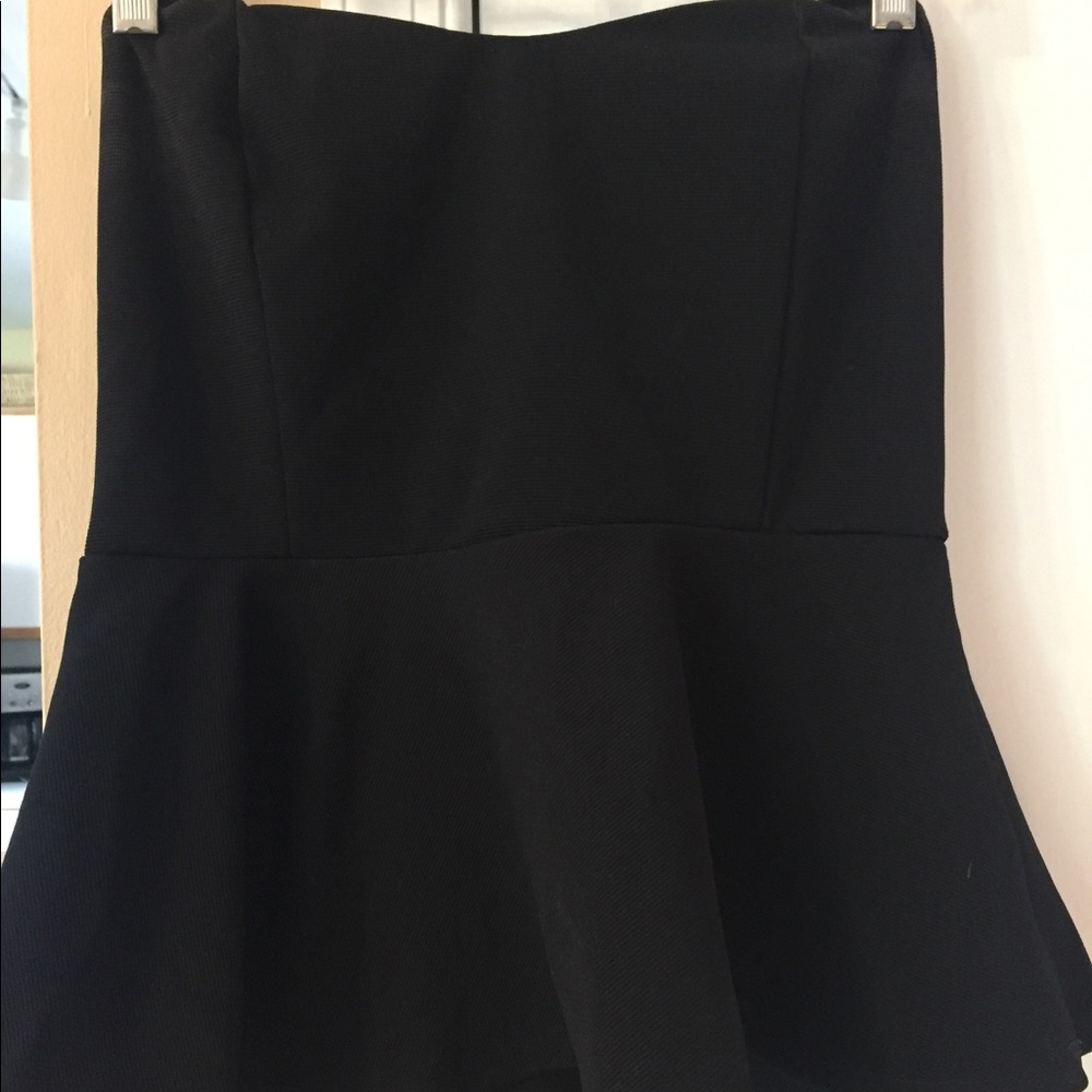 Strapless black peplum top.