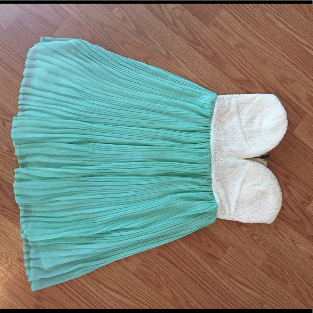 Beautiful strapless turquoise and white dress.