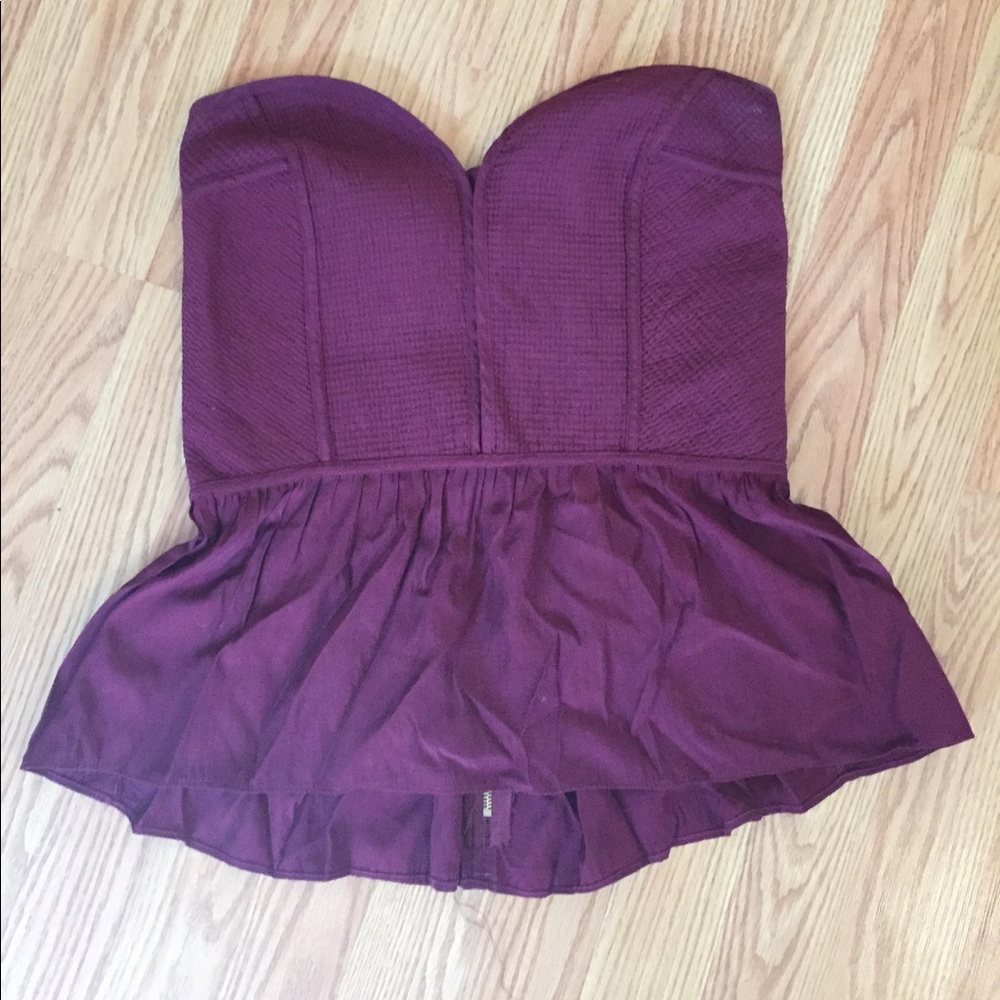 Maroon strapless peplum top.