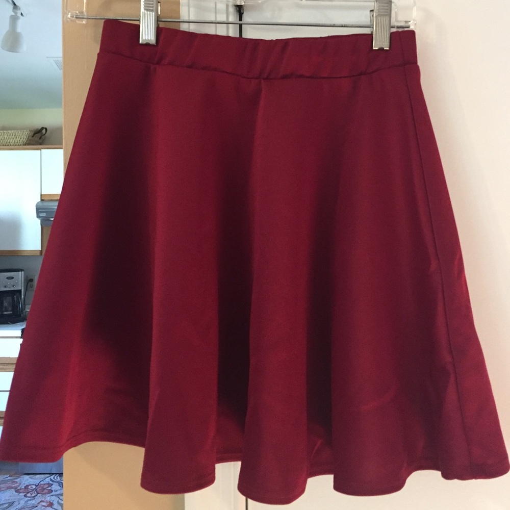 High-waisted red flowy skirt.