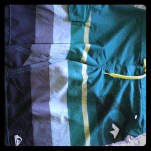 Green and gray Boys Quicksilver swim trunks