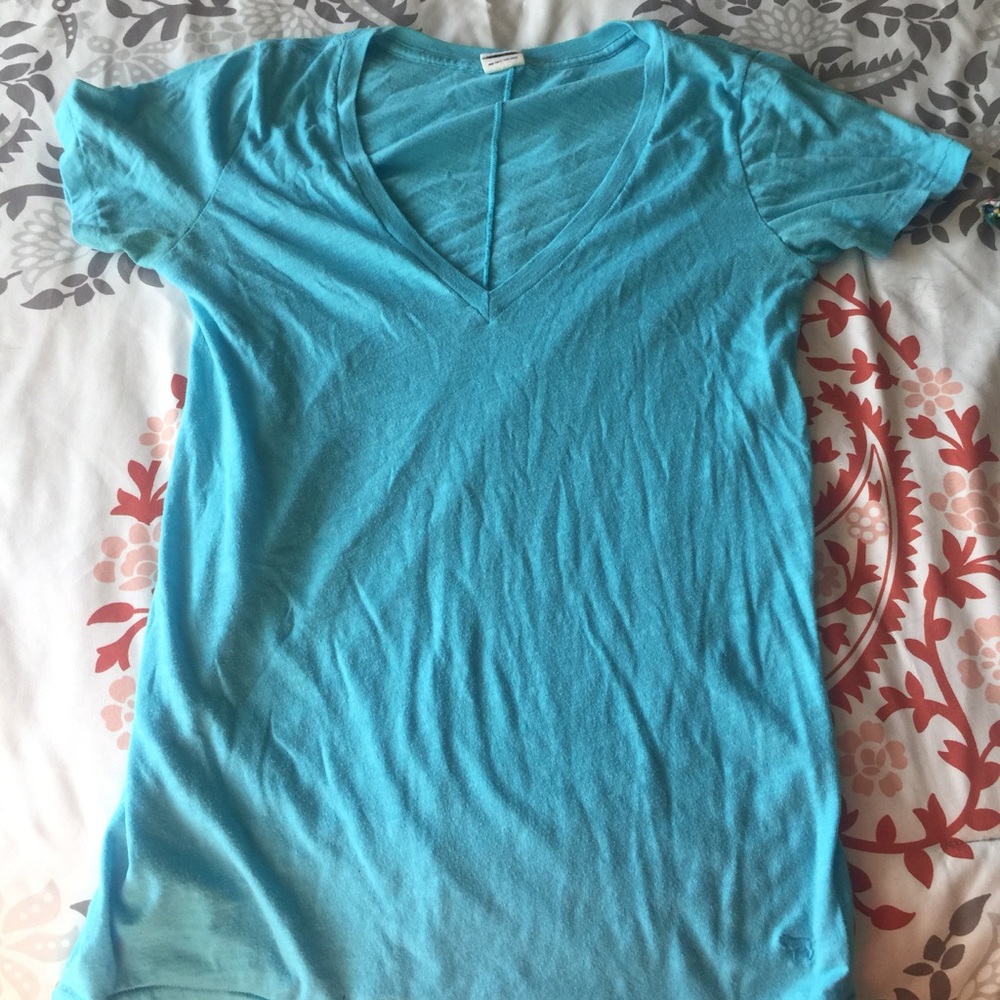Light blue v-necked shirt